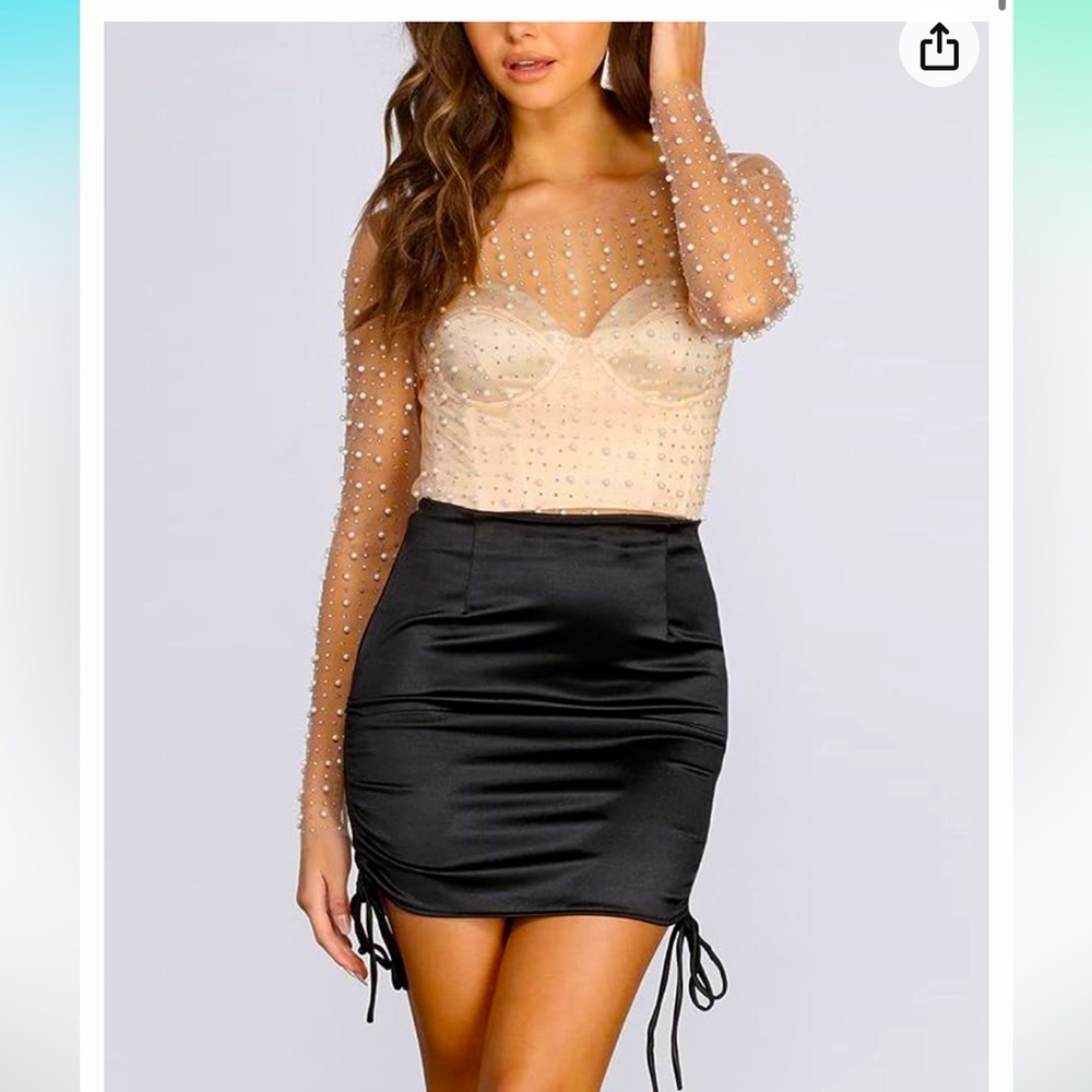 See through pearl beaded top. Never worn still in original packaging